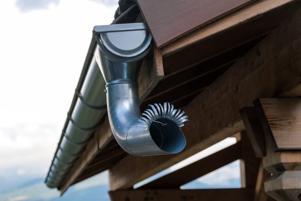 External pipes to drain the water from heavy rains on the roofs of mountain houses